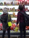 Iran -- Two Iranian citizens shopping in a grocery store in Tehran. March 6, 2022.