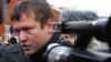 Russia -- Opposition activist Leonid Razvozzhayev gives an interview to journalists outside the Investigative Committee in Moscow, 23Oct2012